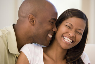 young black couple smiling and laughing with nice teeth, Mequon, WI cosmetic dentist
